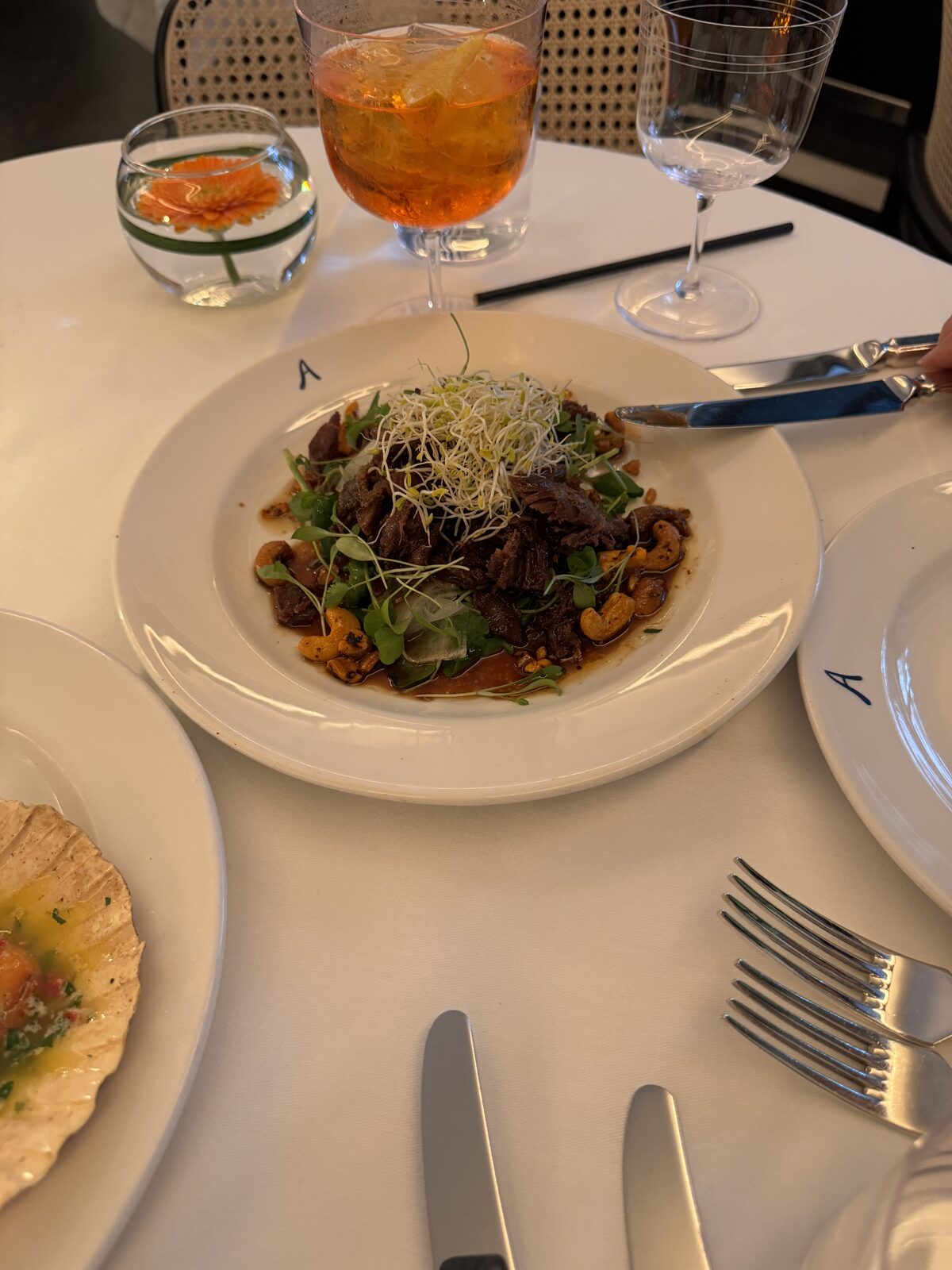 Crispy duck salad with cashews and sprouts